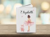 white hard covered journal featuring a water color ballerina and ballet slippers, with the name 'Elizabeth' in cursive at the top. 