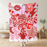 A throw blanket in shades of reds and pinks featuring pop culture graphics like lip prints, sunglasses, peace signs, and the camp name 'Wah-Nee'.