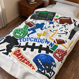 A white bedding set, including a comforter, printed with a colorful football-themed 'TOUCHDOWN' design, shown on a bed in a bedroom setting.