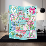 An ombre turquoise throw blanket with a collage style of all things mahjong. Tiles, flowers, sunglasses, coffee and cute little mahjong phrases like "mahj happens" and "talk tiles to me". The colors are bright and 'preppy' style. 