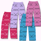 Four pairs of lounge pants in pink, purple, and blue, each printed with a repeating pattern of crossed  field hockey sticks and the name JORDYN.