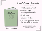 A hardcover journal shown on a pale pink background with printed product details. The journal has a light sage green cover, a visible spine, and the name Stephanie with a volleyball illustration on the front.