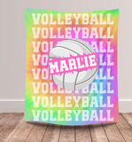 Tie dye background throw blanket with text 'VOLLEYBALL' on repeat down the whole blanket. A big white volleyball in the center, with a name going through the ball. 