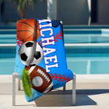 Personalized towel with sports-themed design and name 'Michael' with a blue background laying over a chair.
