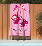 Pink beach towel with disco cherries and 'Canadensis Pool Club' text 