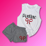 White tank top with cursive text 'PONTIAC' and red bow underneath, and grey shorts with red bow. 