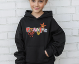 Black hoodie with ransom style decorative text spelling out a camp name, with a leopard print star, red bow and glittery gold heart. 