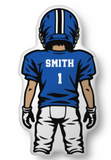 A football player throw pillow seen from the back, wearing a blue helmet and jersey with white lettering that reads "SMITH" and the number 1, on a black background.