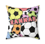 A square decorative throw pillow featuring a colorful soccer ball pattern with the name 'SLOAN' printed across the front in large pink letters, shown on a plain white background.
