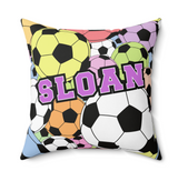 A square decorative throw pillow featuring a colorful soccer ball pattern with the name 'SLOAN' printed across the front in large purple letters, shown on a plain white background.