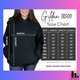 Person wearing a black hoodie with Gildan 18500 size chart on a colorful background