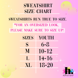Sweatshirt size chart for youth on a gradient pink and yellow background